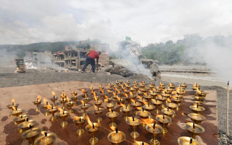Nepal mourns flood victims as families cling to hope for the missing