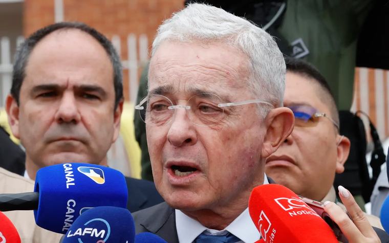 Former Colombian leader denies role in bloody 1990s massacres