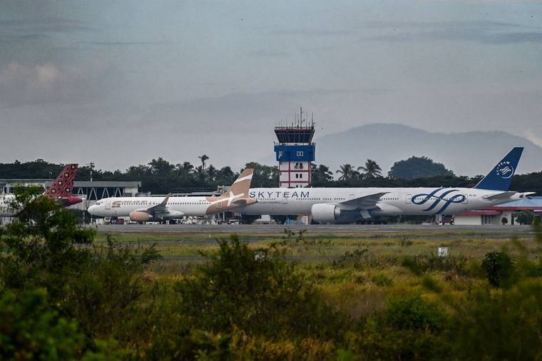 Jakarta airport extends closure to Monday evening after volcano eruption